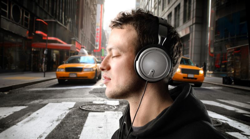 Wearing headphones or earbuds while walking